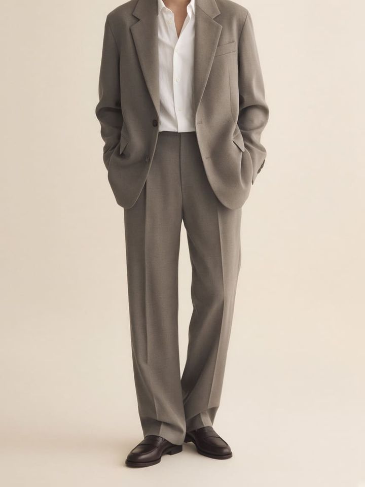 Illustration: eased-shoulder soft blazer and unbroken pant line